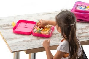 preparing lunch for child school top view on white background; Allergy-Friendly School Lunch Ideas