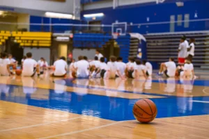Group of teens at a basketball training session on an indoor court in Victoria, BC.
